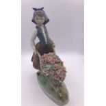 Lladro figure Girl with wheelbarrow of flowers (26cm)