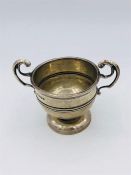 A silver cup, hallmarked Sheffield 1917, makers mark W & H.