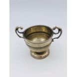 A silver cup, hallmarked Sheffield 1917, makers mark W & H.