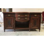 A sideboard in mahogany with bow front.