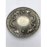 A Chinese white metal coin tray