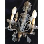 A Four Arm Glass and gilt Chandelier with glass lustres and central glass stem.