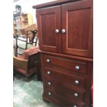 A Tall Boy or linen press style cabinet with blue ceramic handles