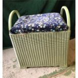 A Lloyd Loom laundry basket