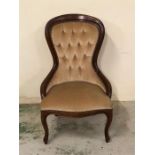 A Queen Anne style bedroom chair with button back detail