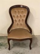 A Queen Anne style bedroom chair with button back detail