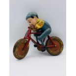 A Tri Ang Vintage toy, boy on bike