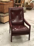 A Low armchair with Oxblood seat pad and back, made by Cintique.