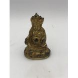 A small Oriental figure of Buddha.