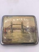A Vintage British cigarette case depicting views of London, London Bridge and the Cenotaph