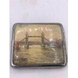 A Vintage British cigarette case depicting views of London, London Bridge and the Cenotaph