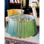 A Large Chrome ceiling light with six candle style lights and a pale green pleated shade (80cm