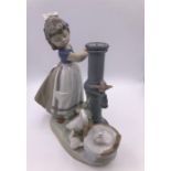 Lladro figure of a young girl at a water pump with a goose