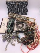 A selection of costume jewellery and a Vintage evening bag.