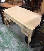 A large cream dressing table