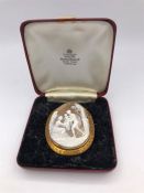 A Large Cameo in gold with a classical scene (7cm x 5.5cm)