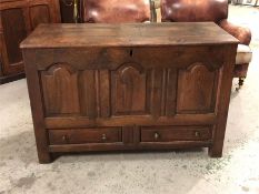 A large oak coffer with two drawers to base.