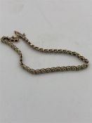 A 9ct yellow gold and diamond bracelet (7.2g)