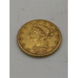 An 1887 United States of America Five Dollar coin (8.4g)