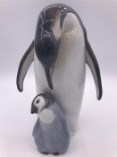 A Lladro figure 'Penguin Love' 19cm Tall.