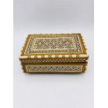 An Ornate box with decorative inlay