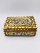 An Ornate box with decorative inlay