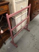 A pink painted vintage clothes rail