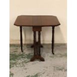 Small Mahogany gateleg table, brass castors to legs.