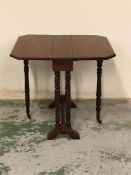 Small Mahogany gateleg table, brass castors to legs.