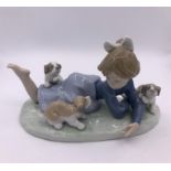 Lladro Figure of a girl playing with puppies (10cm)