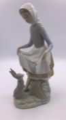 Lladro figure of a Girl Feeding a Rabbit (24cm)