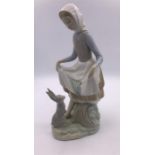 Lladro figure of a Girl Feeding a Rabbit (24cm)