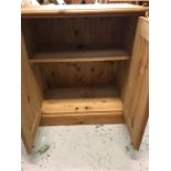 A Pine two door cupboard