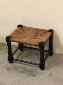 A small oak stool with rush seat