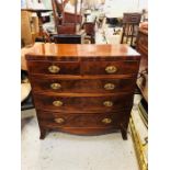 A Bow fronted two over three chest of drawers with inlay and decorative handles.