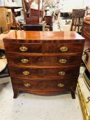 A Bow fronted two over three chest of drawers with inlay and decorative handles.