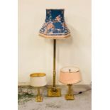 A selection of lamps, one floor standing and two similar style table lamps