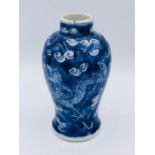 A Chinese vase blue and white vase with dragon decoration 13cm tall. Kangxi period.