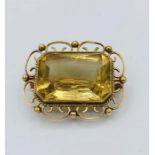 A citrine brooch in a 9ct yellow gold setting.