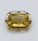 A citrine brooch in a 9ct yellow gold setting.