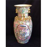 A large Chinese Famille Rose vase with gilded handles
