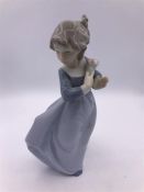 Nao figure of a girl holding flowers (20cm)