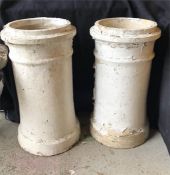 A Pair of white painted chimney pots, ideal garden planters.