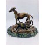 A Bronze of a Pair of Whippets, signed to base Barye.