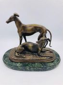 A Bronze of a Pair of Whippets, signed to base Barye.