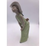 Lladro Figure of a Curious girl, hands on knees (23cm)