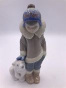 A Lladro Figure 'Eskimo Boy with pet'