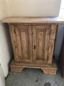 A Pine two door cabinet 99cm x 88cm.