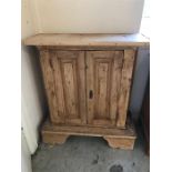 A Pine two door cabinet 99cm x 88cm.