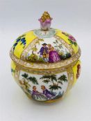 A Meissen hand painted and lidded pot.